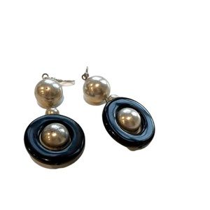 Vintage hanging silver and black earrings.
